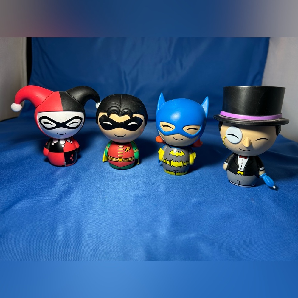 Lot of 4 Funko Dorbz including: batgirl , robin , Harley Quinn, penguin